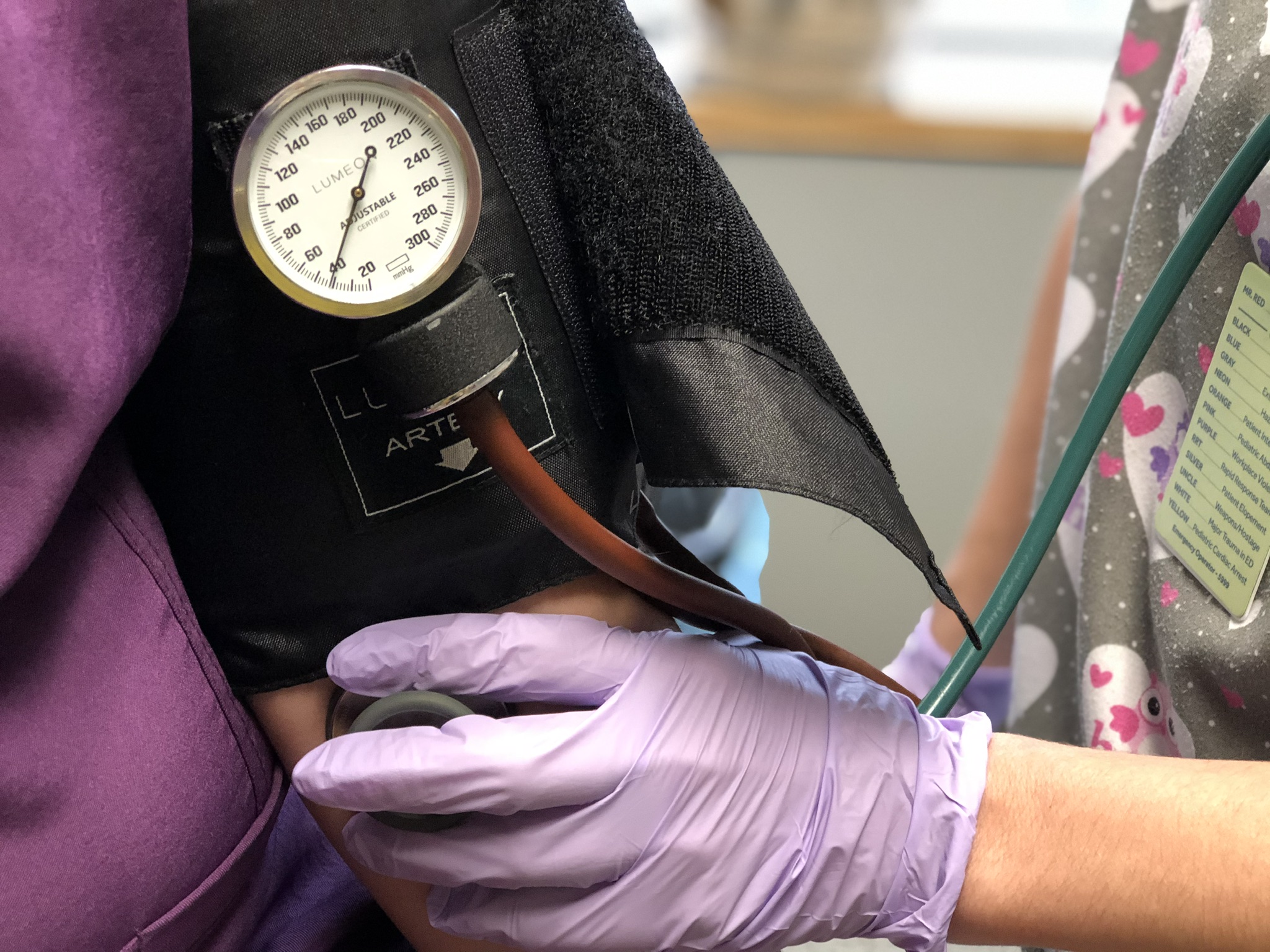 Physician listening to patient's heart